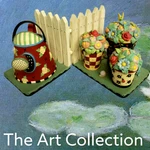 Mary Engelbreit Bookends Watering Can Flower Pots Picket Fence Michel & Company. Fixed Price $79.99.